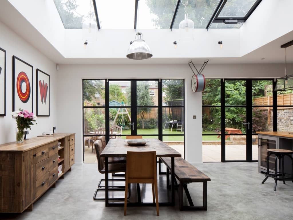 A large dining room with a skylight above it idea