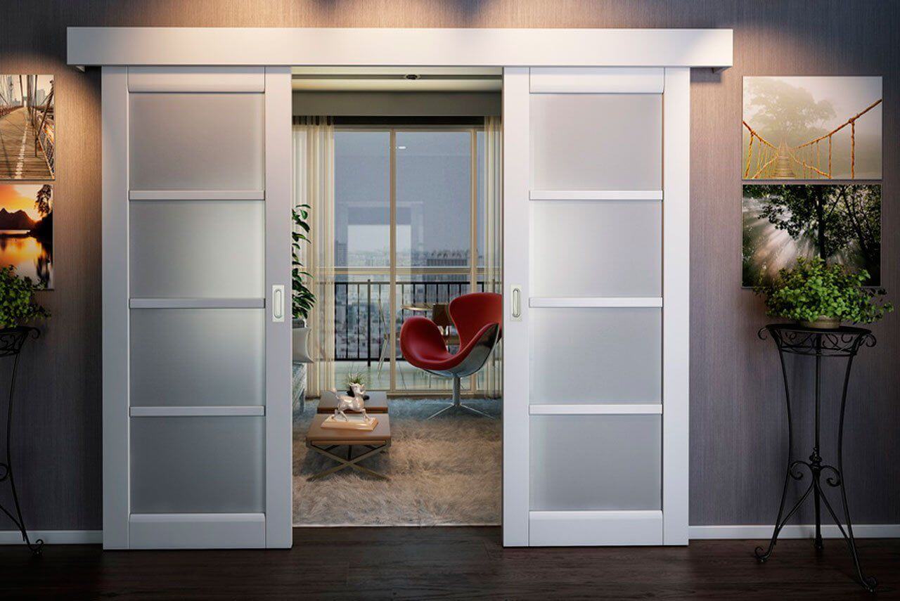 An open Sliding door leading to a living room with a red chair
