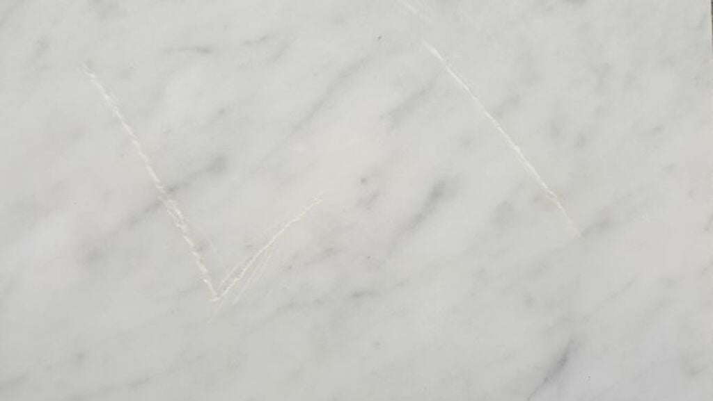 A close up of a white marble surface
