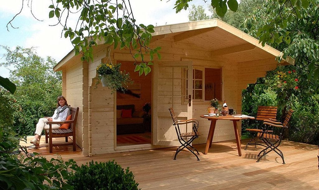 wooden tiny house kits with outdoor seating area