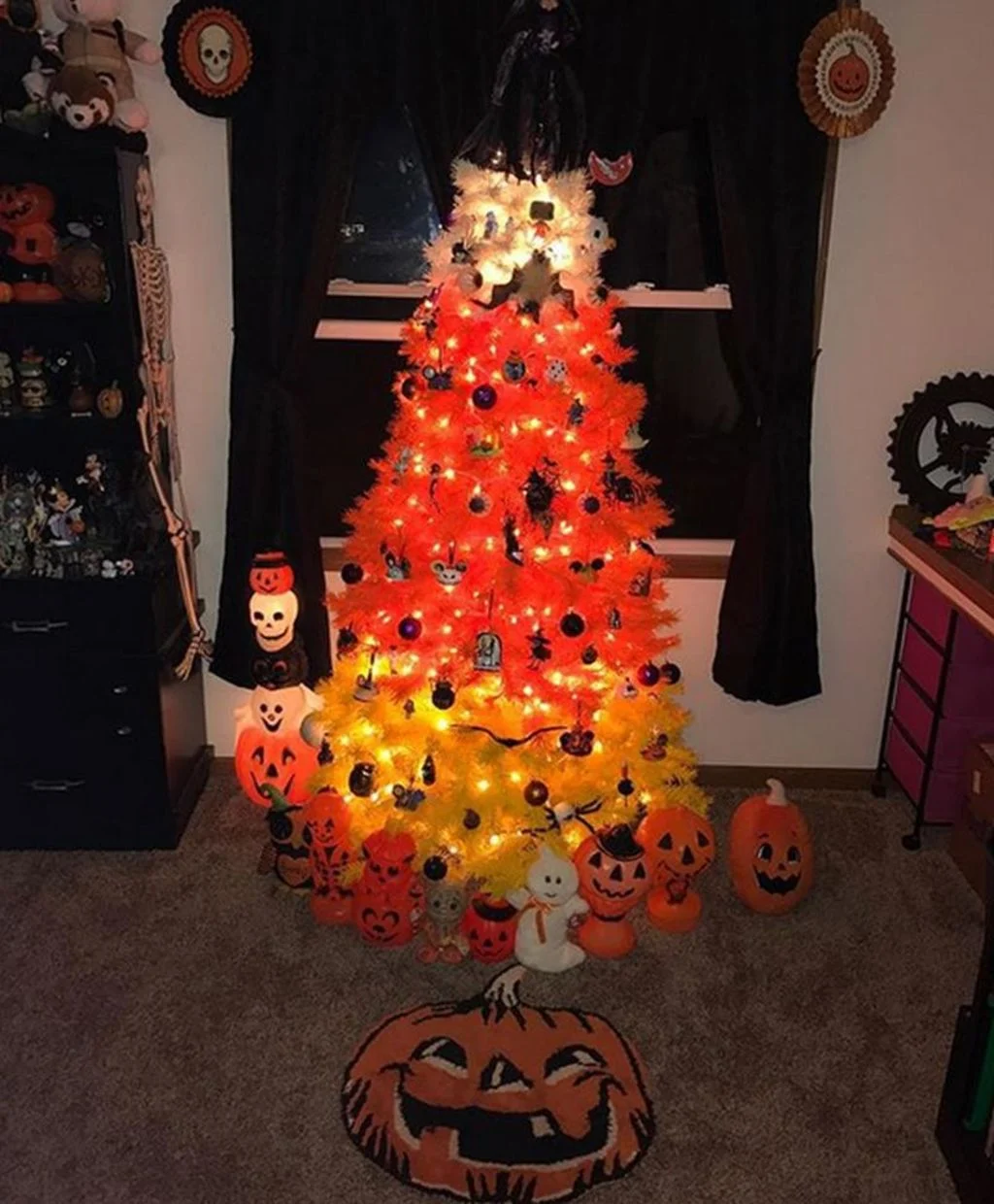 A decorated halloween tree in a living room
