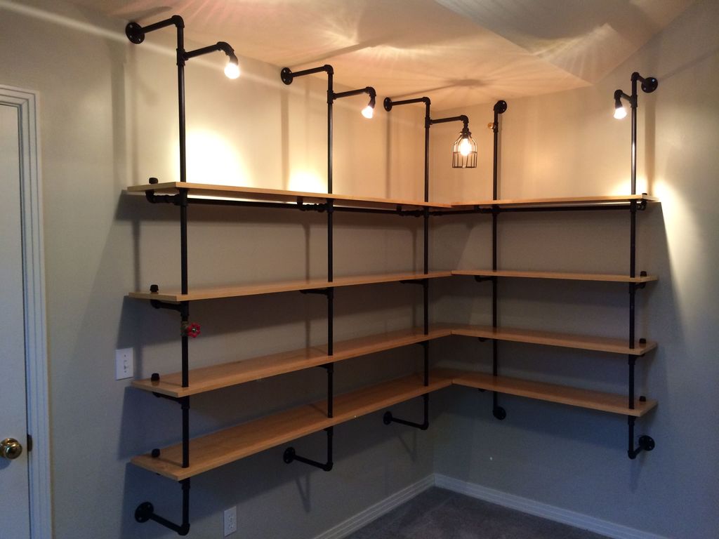 lighted pipe supported storage shelves for basement