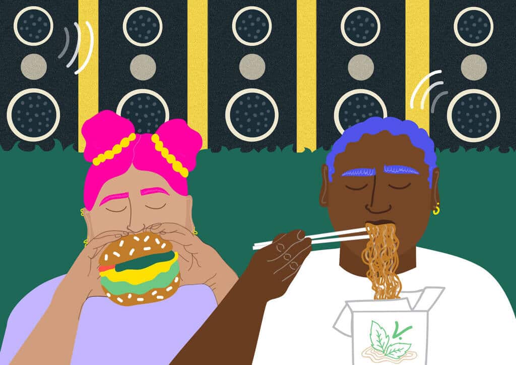 A man and a woman eating a hamburger together
