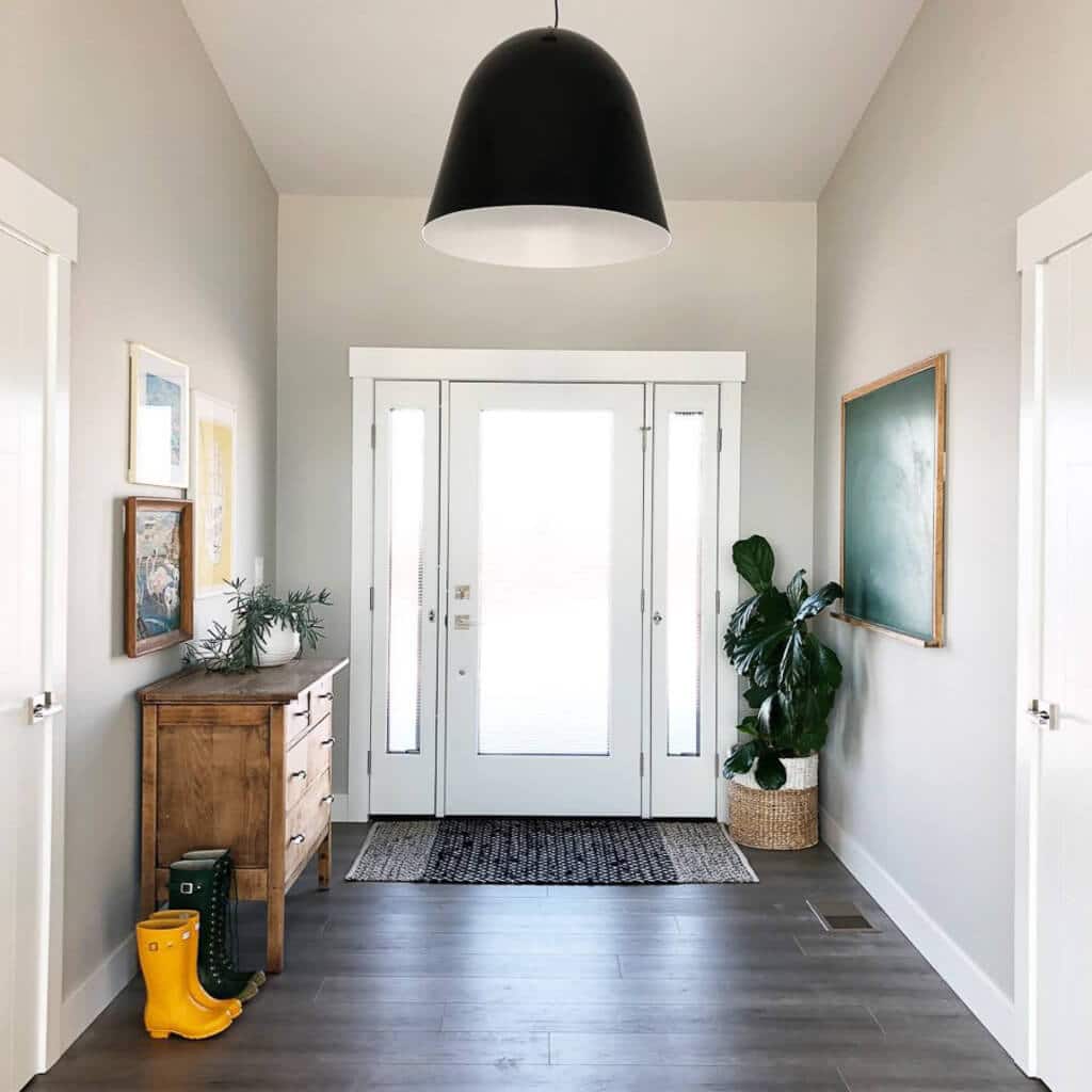 A hallway with a black light hanging from the ceiling
