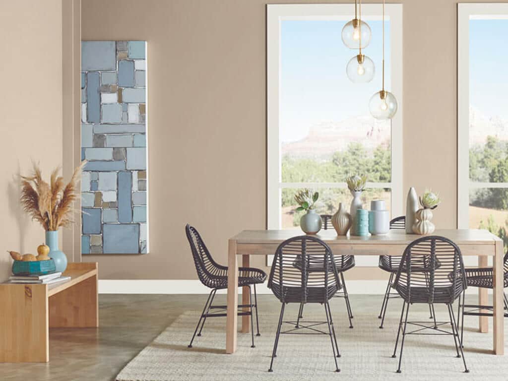 A dining room with a table and chairs
