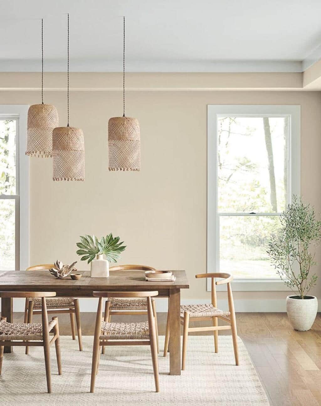 A dining room with a table and chairs
