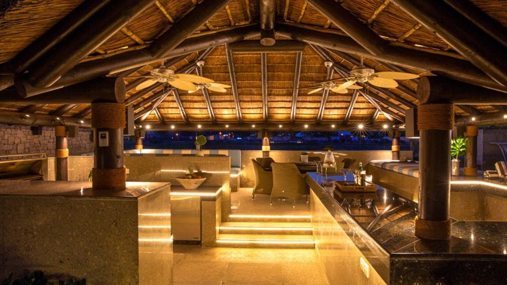 A restaurant with a ceiling made of wood and stone
