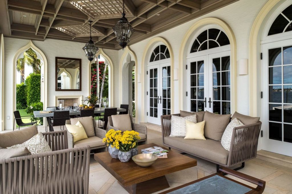 A living room filled with furniture and windows
