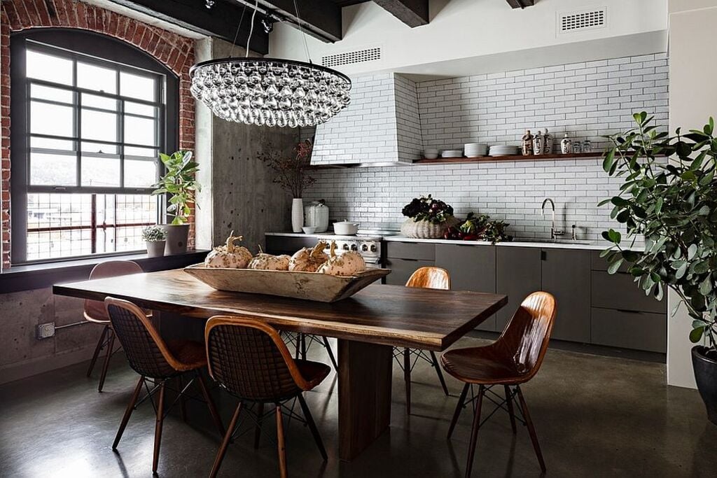 A kitchen with a Modern Live Edge Dining table and chairs and a potted plant
