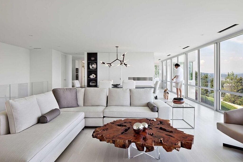 A living room filled with Tree Slice Coffee Table and a large window
