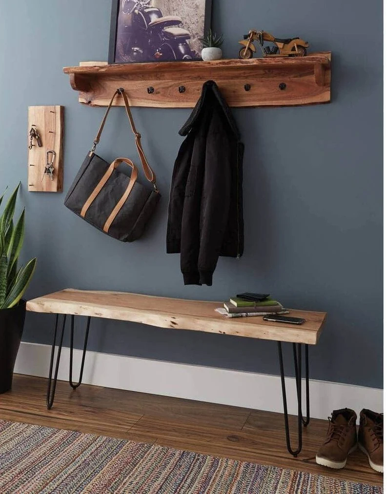 A wooden edge table sitting next to a wall
