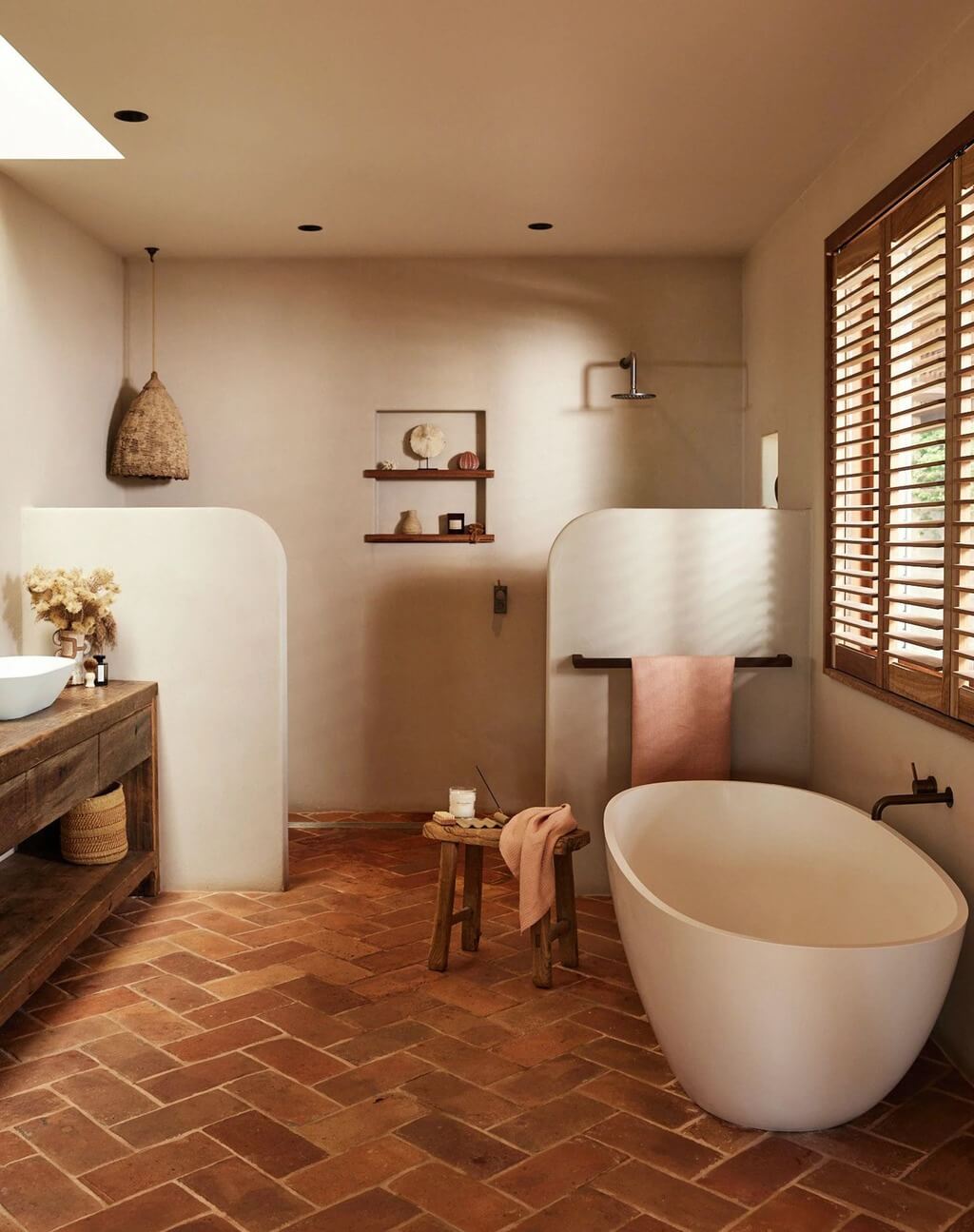 A bathroom with a large tub and a sink
