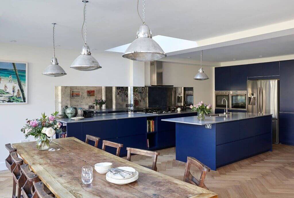 Navy Blue Kitchen Cabinets with Marble Countertops 