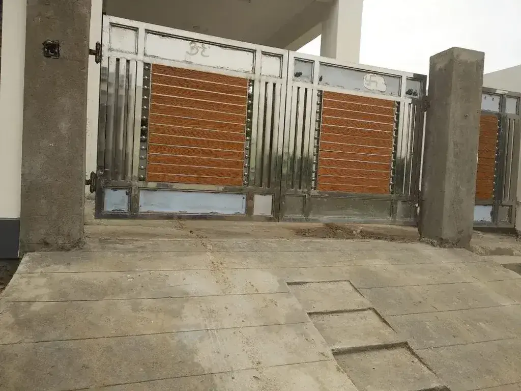 A couple of gates that are on the side of a building
