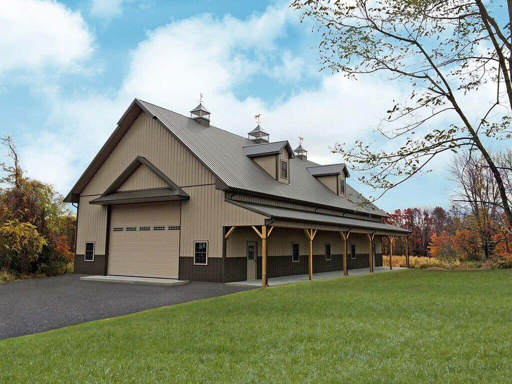 A large brown barn with a covered porch
