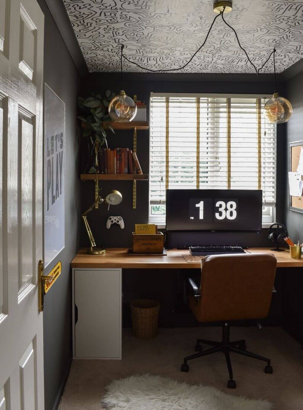 A desk with a computer on top of it
