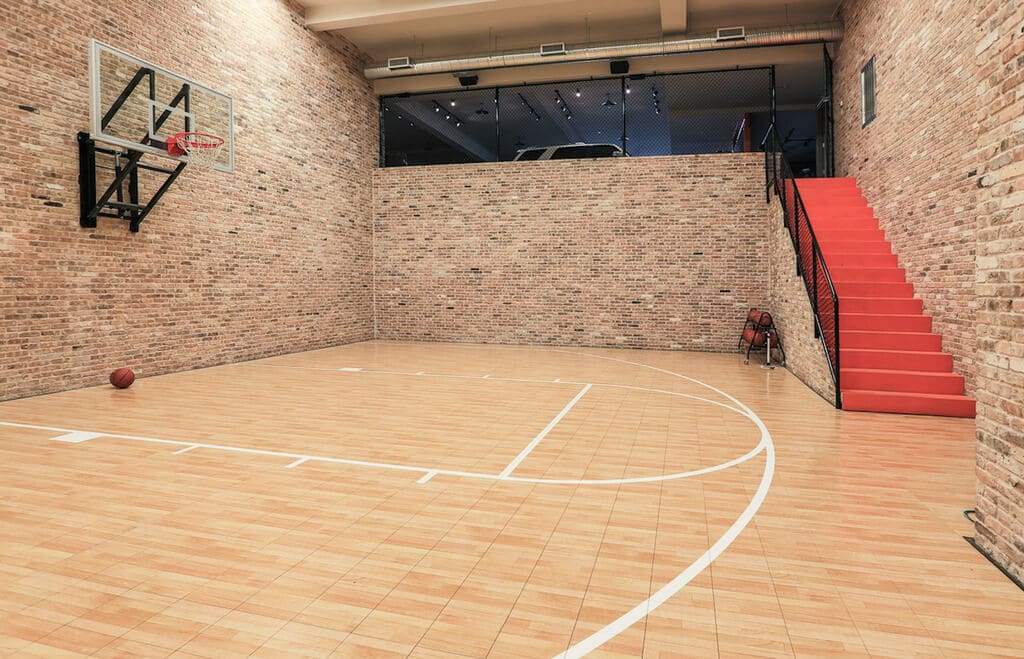 A basketball court with a basketball in the middle of it

