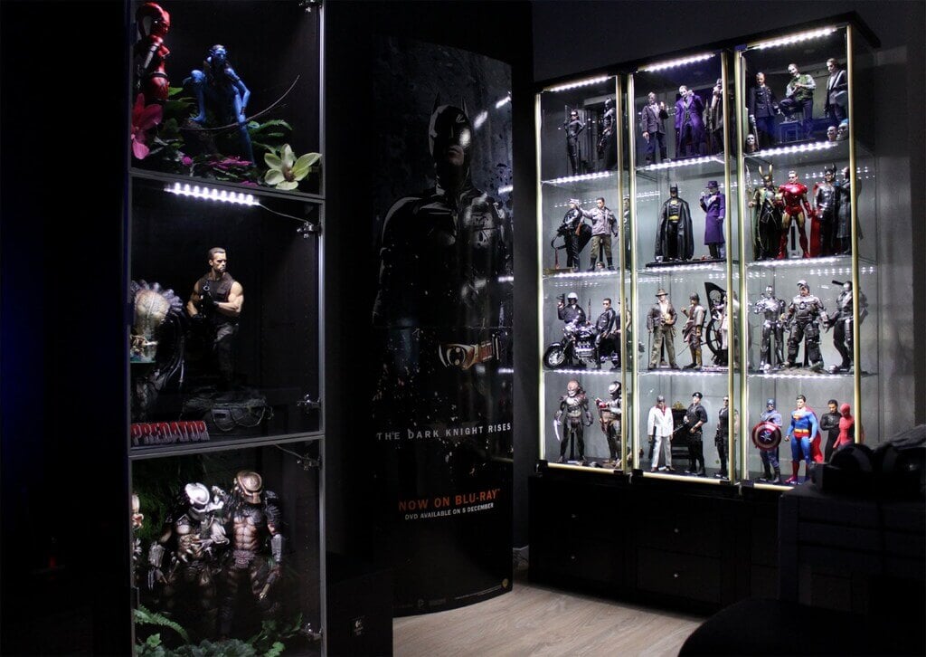 A display case filled with batman action figures
