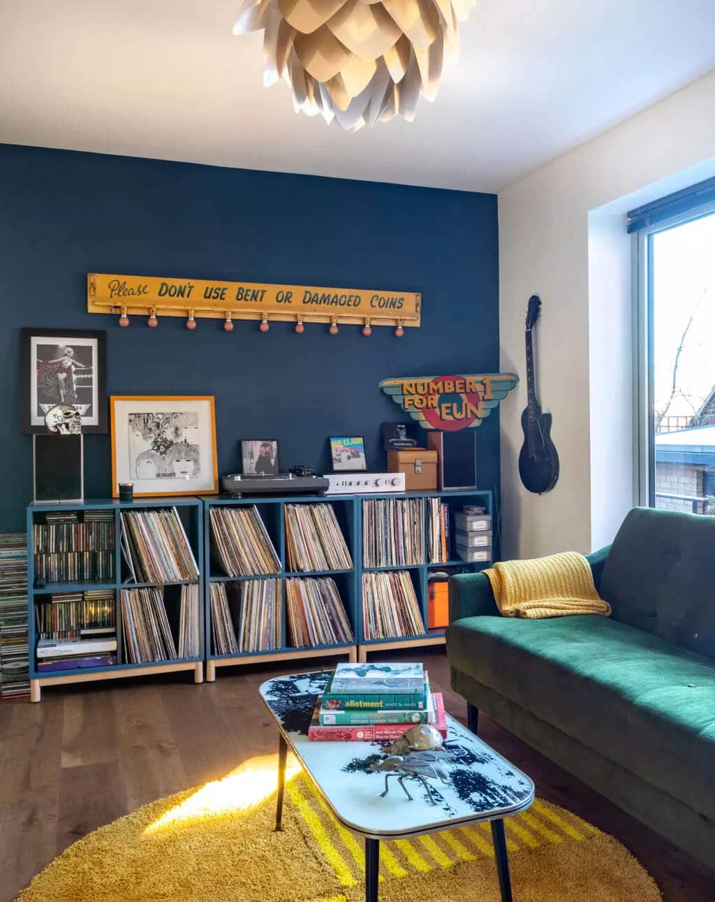 A living room filled with furniture and a book shelf
