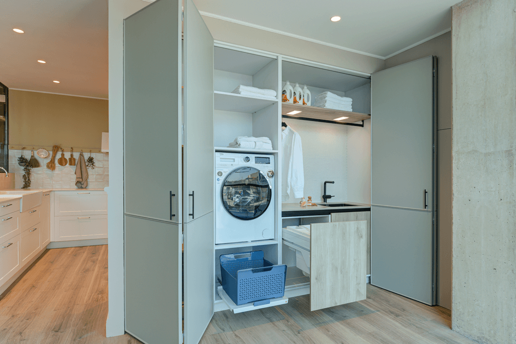 Use Space-Conscious Door Designs in laundry room