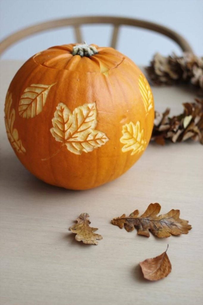  Cool Pumpkin Carving Ideas with Autumn Leaves