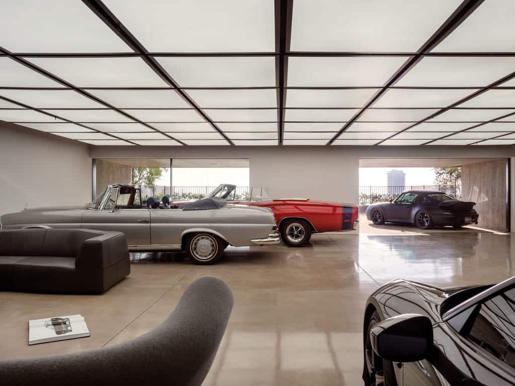 A garage filled with lots of different types of cars

