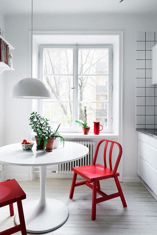white colour decor with red chair