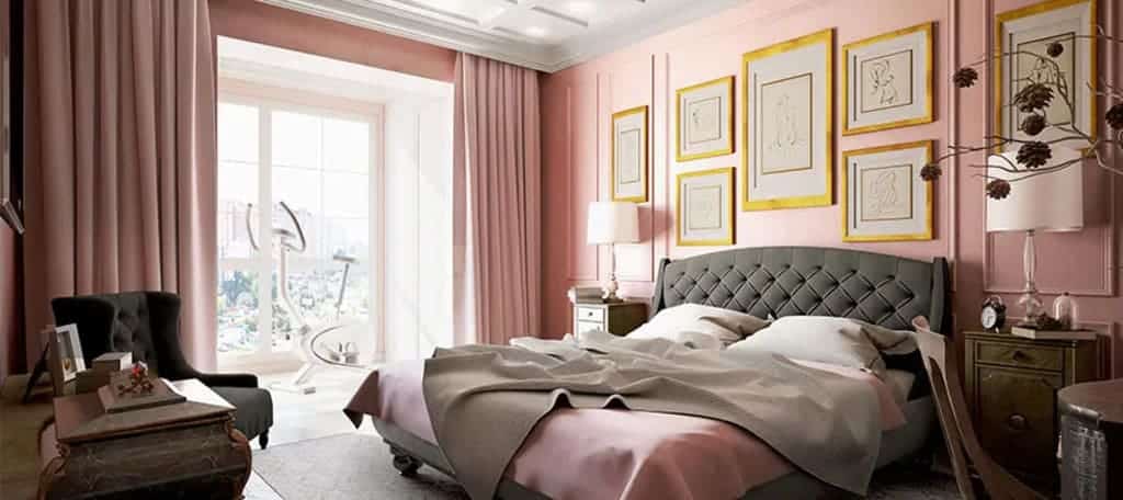 A bedroom with pink walls and a large bed
