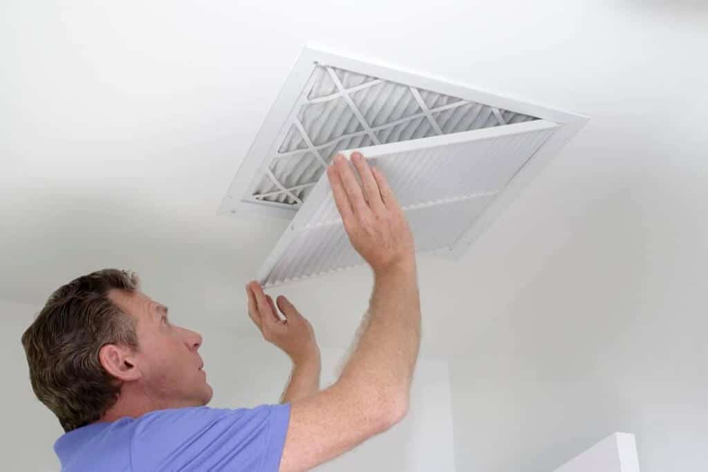 man cleaning  air ducts